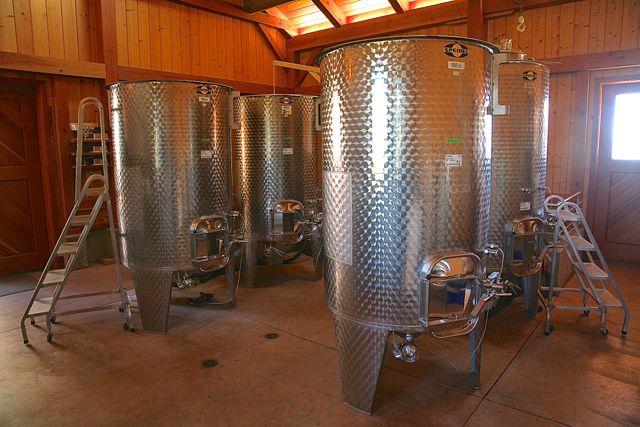 Stainless fermentation tanks in the winery